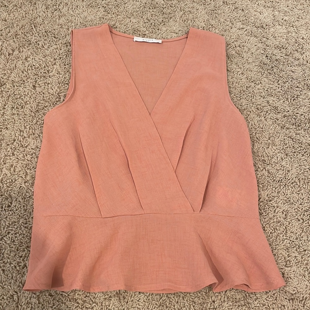 pink blouse with flow on the bottom